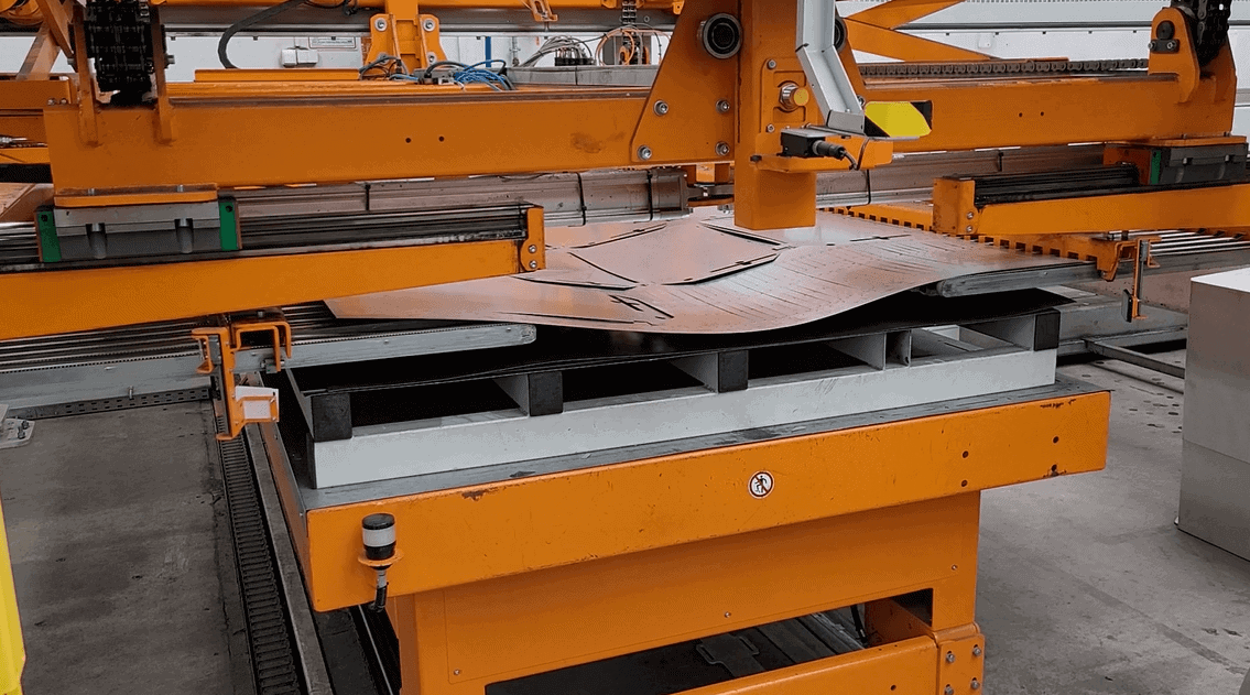 Unloading of cut-out details from the laser by automation